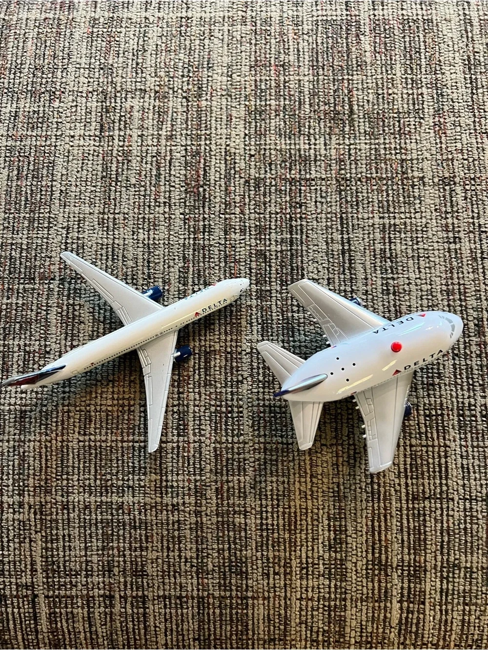 Two Delta Toy Airplanes